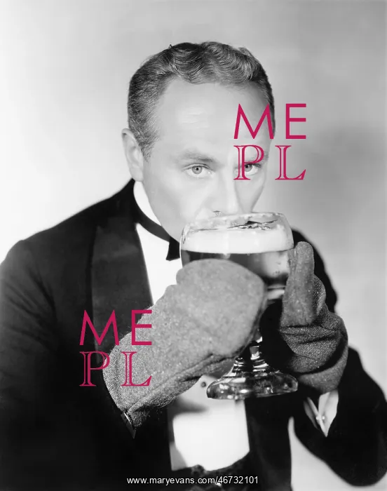  : Man drinking a big glass of cold beer with mittens