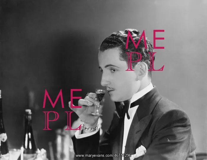 : Man drinking glass of liqueur : Man drinking glass of liqueur