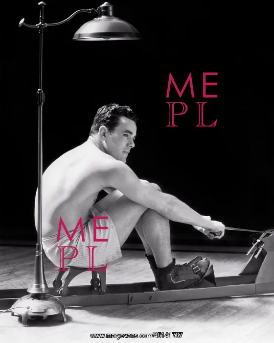 : Man Exercising on Rowing Machine Sitting Under : Man Exercising on Rowing Machine Sitting Under