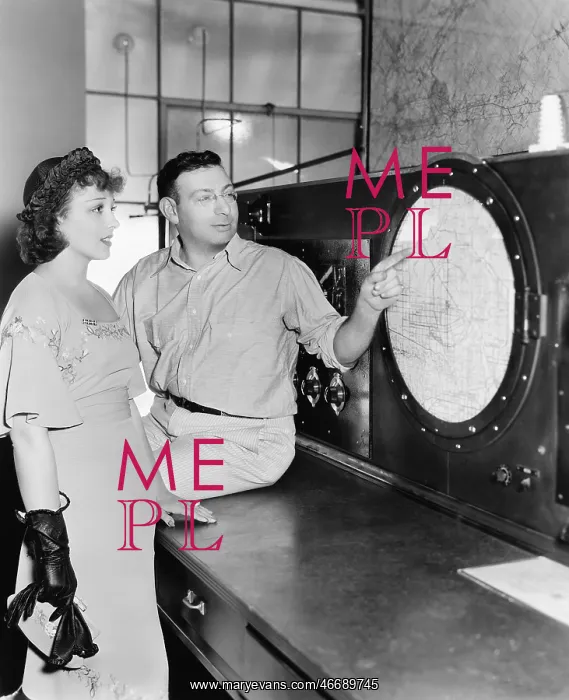 : Man explaining about radar to a young woman in a : Man explaining about radar to a young woman in a