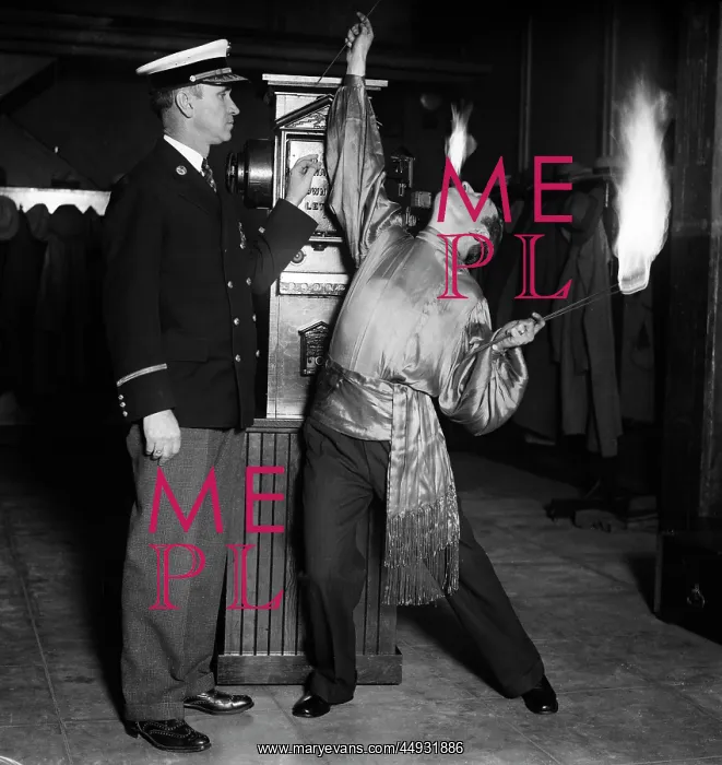: Man Fire Eater Circus Performer Breathing Fire and Holding : Man Fire Eater Circus Performer Breathing Fire and Holding