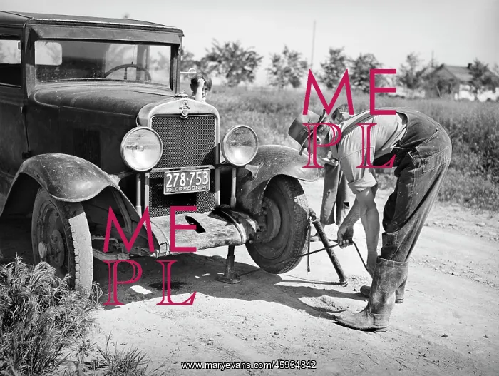  : man - flat tire - repair - car