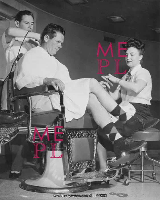 : Man getting his hair cut and nails manicured : Man getting his hair cut and nails manicured