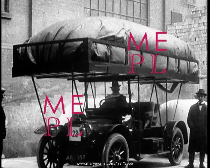 : A Man Getting Into A Motorcar With A Large : A Man Getting Into A Motorcar With A Large