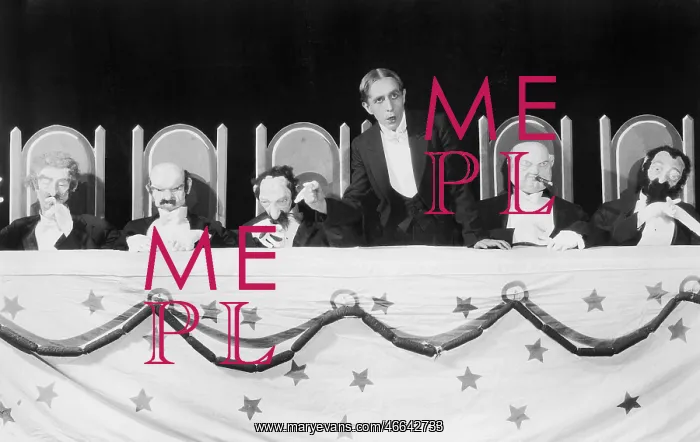 : Man giving a speech with five character puppets : Man giving a speech with five character puppets