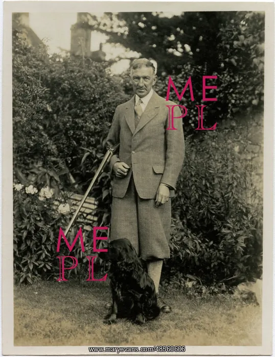  : Man with gun and retriever dog