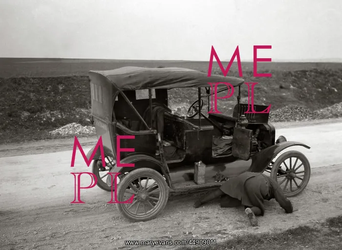: Man On His Hands and Knees Looking Under Model T Broken : Man On His Hands and Knees Looking Under Model T Broken