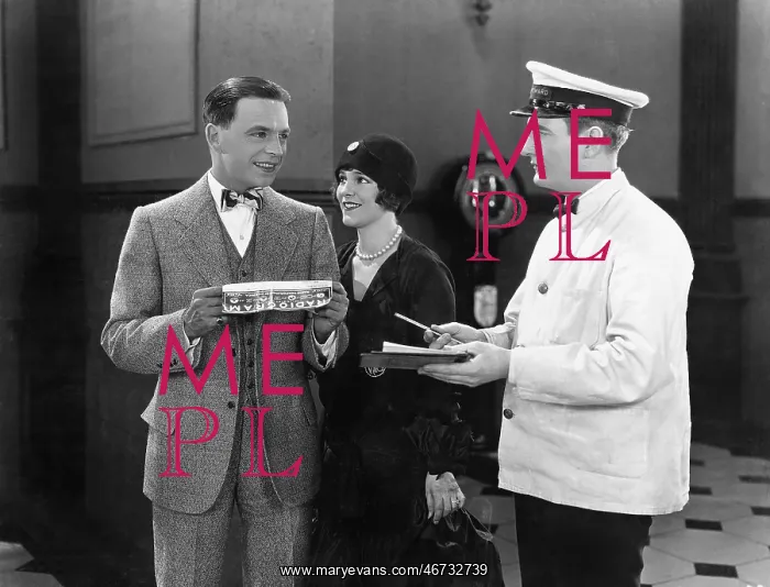  : Man having to sign for a present