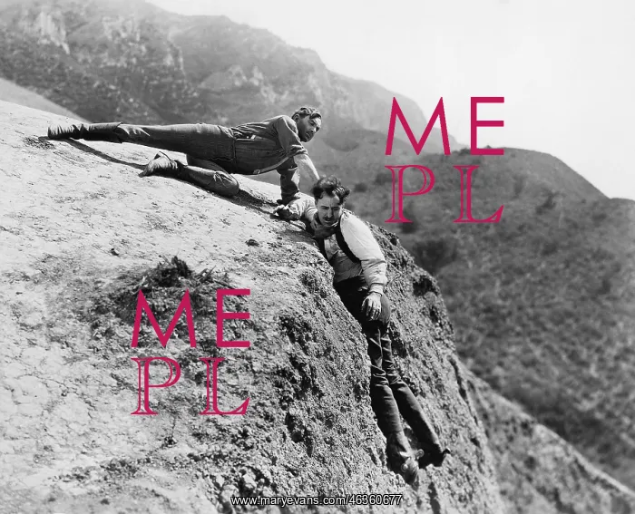 : Man helping another man from falling down a cliff : Man helping another man from falling down a cliff