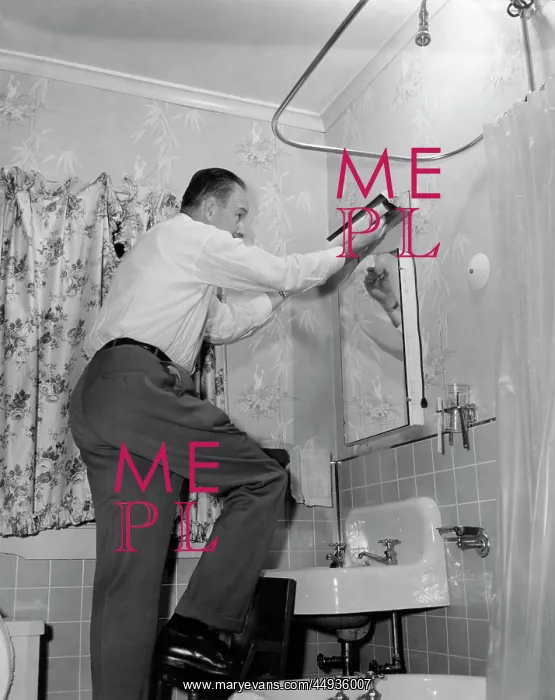 : Man on Home Repair Step Stool in Bathroom Replacing : Man on Home Repair Step Stool in Bathroom Replacing