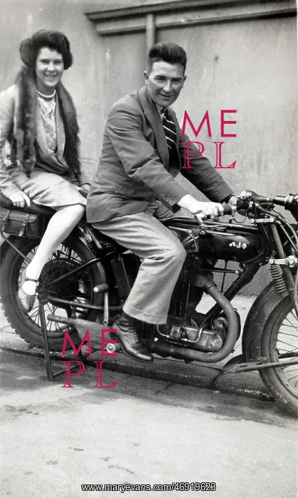 : Man & lady on a 1926 / 7 AJS motorcycle : Man & lady on a 1926 / 7 AJS motorcycle