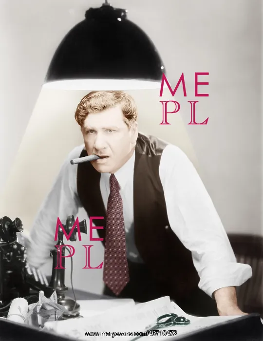 : Man leaning over a desk with a ceiling light shining on him : Man leaning over a desk with a ceiling light shining on him