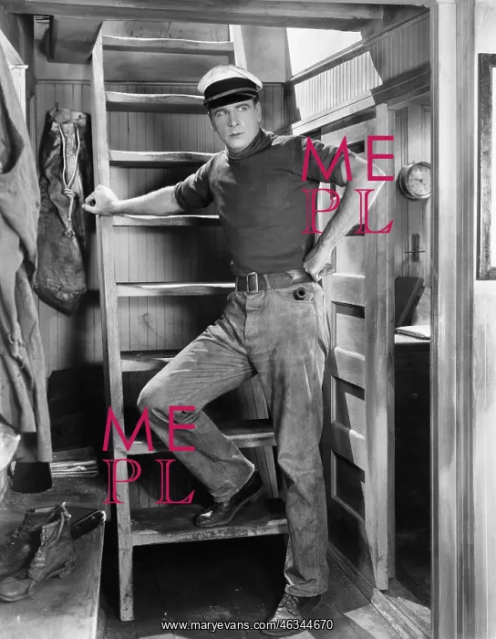 : Man leaning against a ladder : Man leaning against a ladder