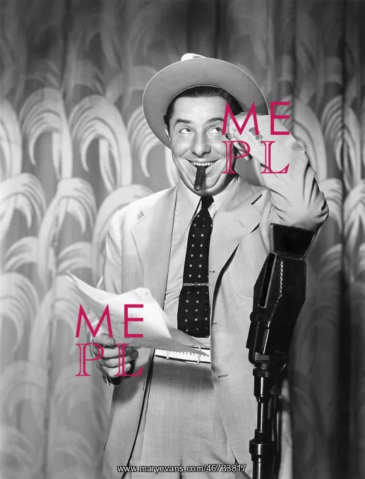 : Man leaning on a microphone looking into the air : Man leaning on a microphone looking into the air