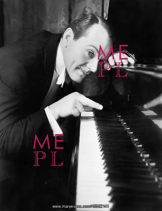  : Man leaning over the piano playing the keys with one finger