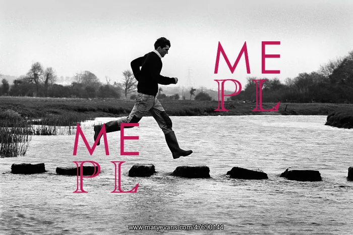 : A man leaps along the stepping stones at Ogmore Castle : A man leaps along the stepping stones at Ogmore Castle