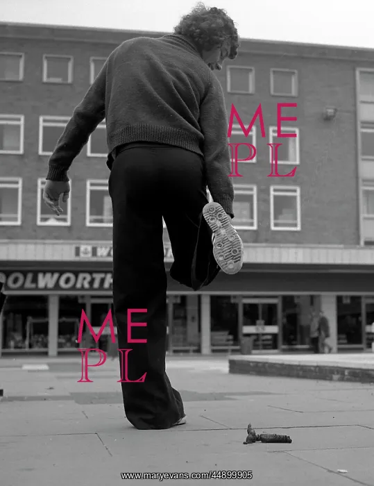: Man lifting his shoe for inspection : Man lifting his shoe for inspection