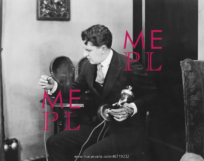 : Man looking at broken telephone wire : Man looking at broken telephone wire