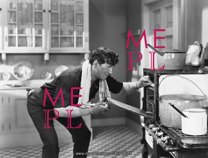  : Man looking into oven