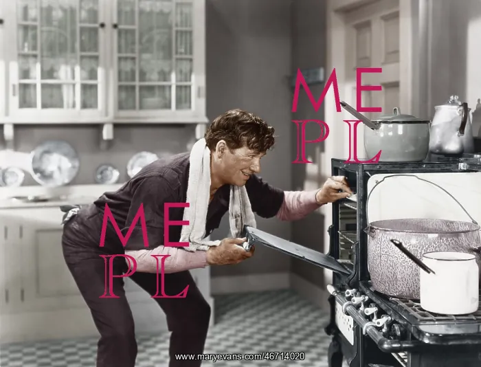 : Man looking into oven : Man looking into oven