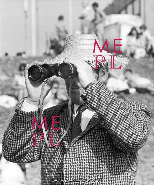 : Man looks through Binoculars - Blackpool : Man looks through Binoculars - Blackpool