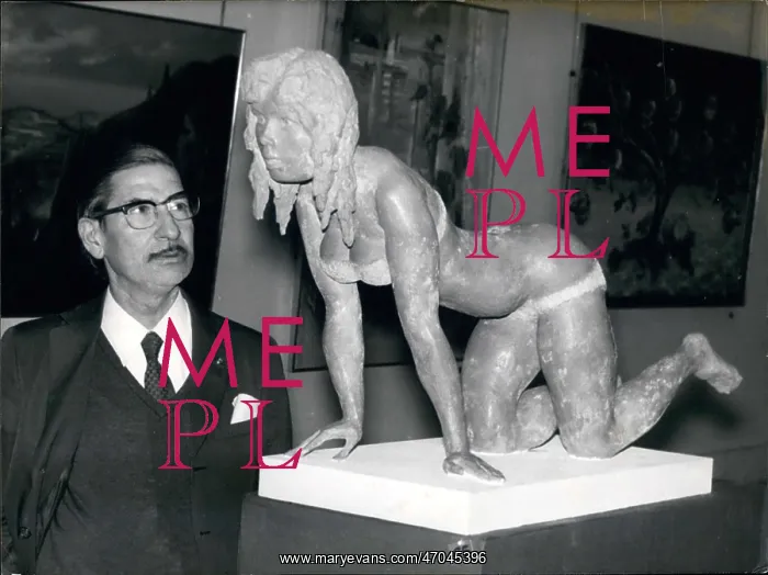 : Man looks at sculpture of Brigitte Bardot : Man looks at sculpture of Brigitte Bardot