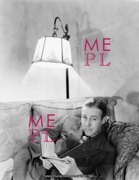 : Man lying on a couch and holding a book : Man lying on a couch and holding a book
