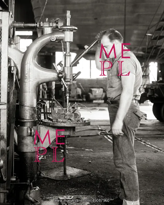 : Man Machinist Standing Working a Drill Press : Man Machinist Standing Working a Drill Press