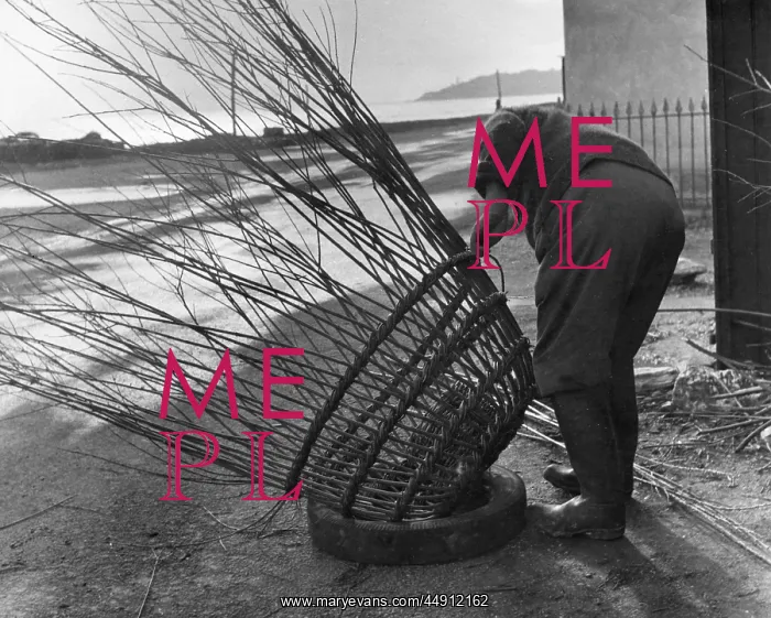 : Man making lobster pot at Beesands, Start Bay, Devon : Man making lobster pot at Beesands, Start Bay, Devon