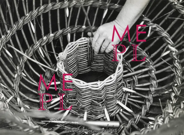 : Man making lobster pot at Beesands, Start Bay, Devon : Man making lobster pot at Beesands, Start Bay, Devon