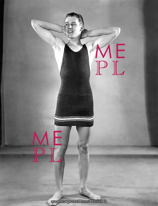 : Man modelling a one-piece swimsuit : Man modelling a one-piece swimsuit