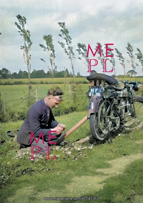 : Man with motorbike in a field : Man with motorbike in a field