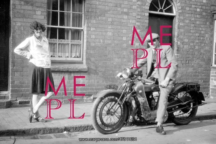  : Man on a motorcycle with girlfriend