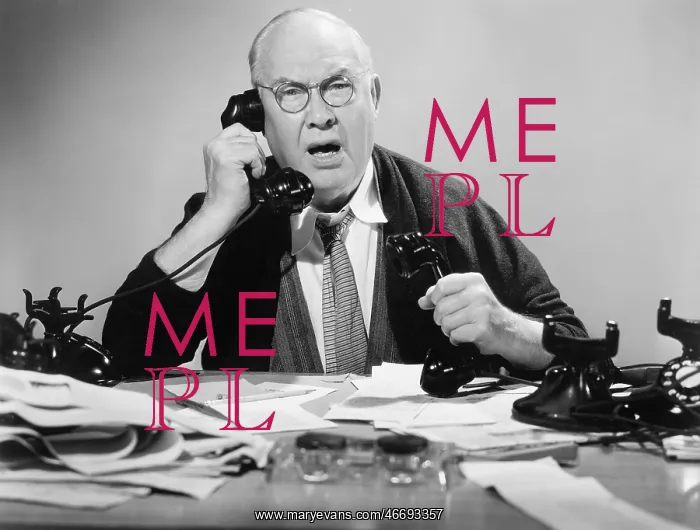  : Man on multiple telephones looking angry