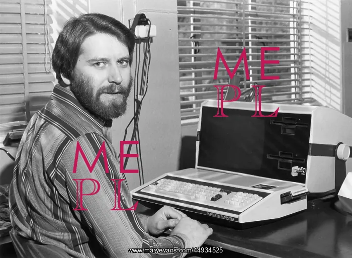 : Man in an office with an Exidy Sorcerer computer : Man in an office with an Exidy Sorcerer computer