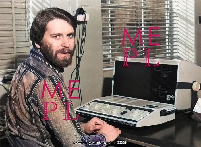 : Man in an office with an Exidy Sorcerer computer : Man in an office with an Exidy Sorcerer computer