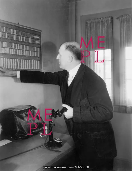  : Man in his office looking at a board