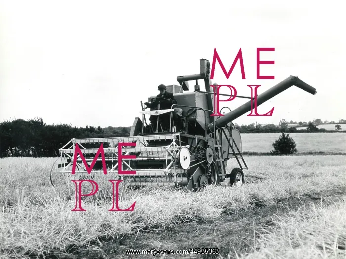 : Man operating a combine harvester, Cornwall : Man operating a combine harvester, Cornwall