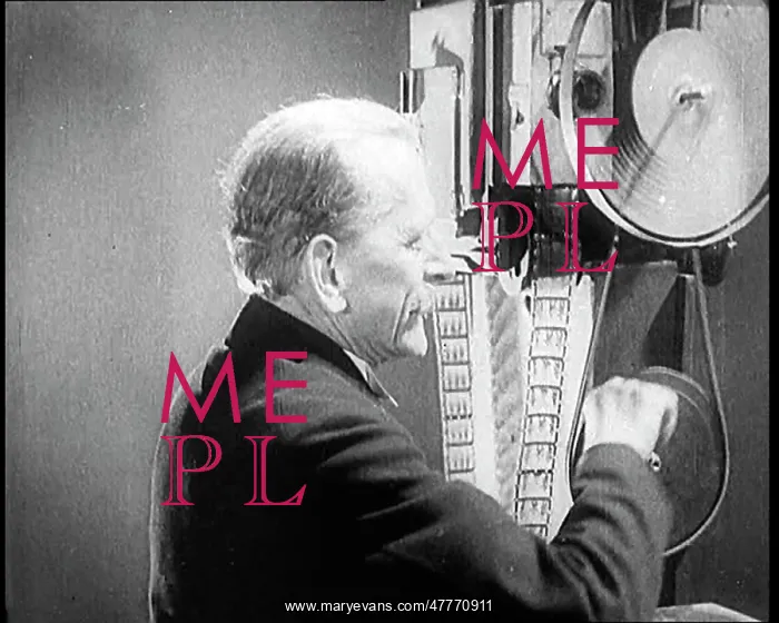 : Man Operating An Early Cinematograph Machine : Man Operating An Early Cinematograph Machine