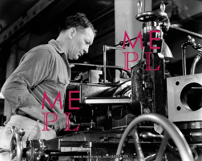: Man Operating Industrial Lathe Machine : Man Operating Industrial Lathe Machine