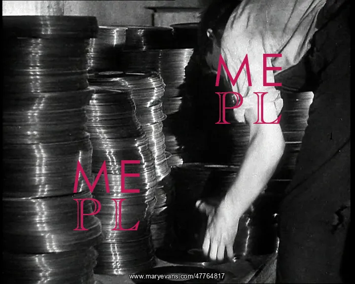 : A Man Organizing Vinyls to Use For War Materials : A Man Organizing Vinyls to Use For War Materials