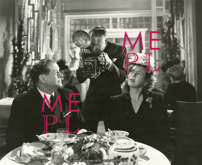 : Man photographing couple in restaurant - : Man photographing couple in restaurant -