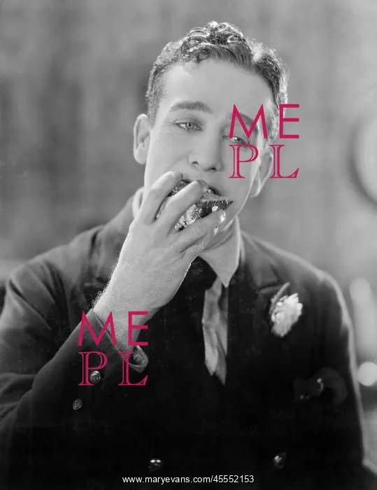 : Man with a piece of cake in his mouth : Man with a piece of cake in his mouth