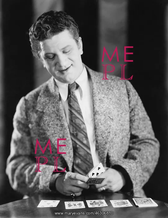 : Man playing with a deck of cards : Man playing with a deck of cards