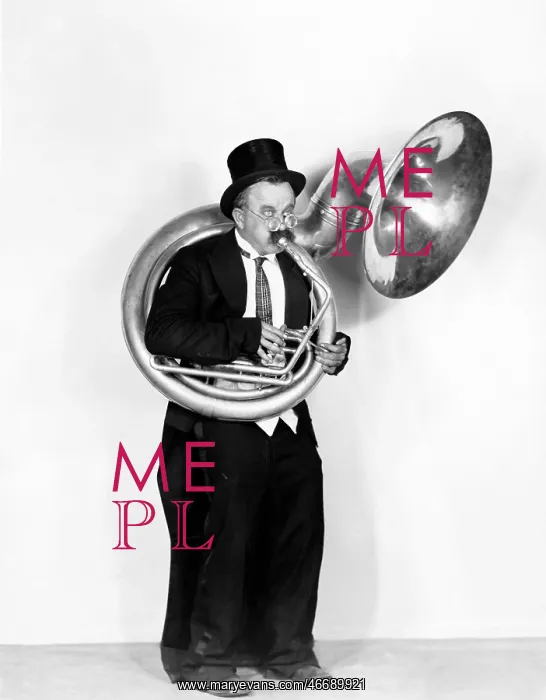 : Man playing a tuba in a top hat : Man playing a tuba in a top hat