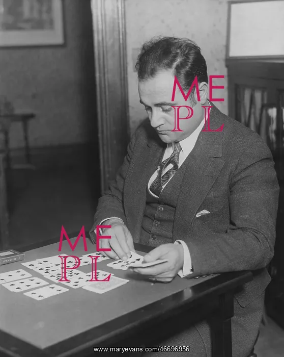 : Man plays solitaire : Man plays solitaire