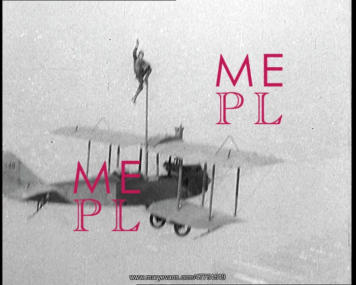 : Man Pole Squatting On Top of a Flying Biplane : Man Pole Squatting On Top of a Flying Biplane