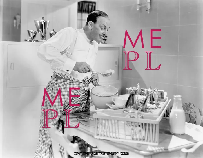 : Man preparing food in a kitchen : Man preparing food in a kitchen