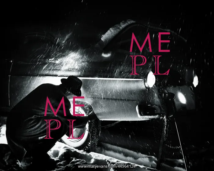 : Man Putting Chains on Rear Tires at Night : Man Putting Chains on Rear Tires at Night