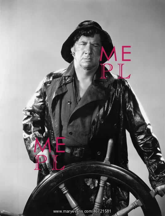 : Man in raincoat steering boat : Man in raincoat steering boat